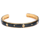 Gold bangle stars black