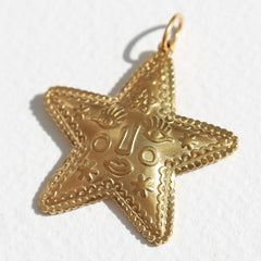 Gold star charm