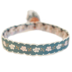 Pulsera tejida flor de algodón gris/azul