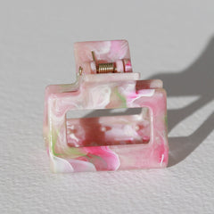 Remolino de pinza de pelo rosa claro pequeño