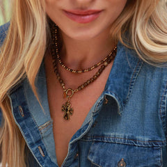 Amber cross charm
