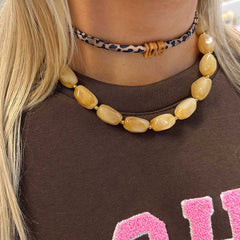 Golden necklace rocks beige