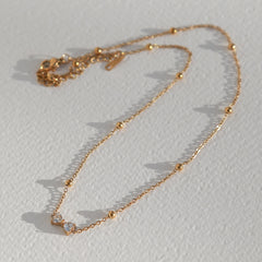 Gouden ketting strikje strass