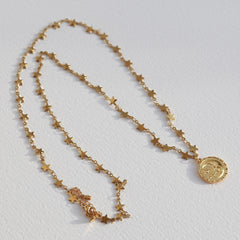 Gouden lange ketting maan en zon