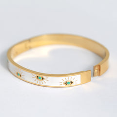 Gold bangle evil eye