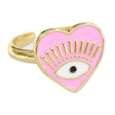 Anillo de oro con ojo malvado y corazón rosa