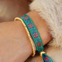 Pulsera tejida flor azul