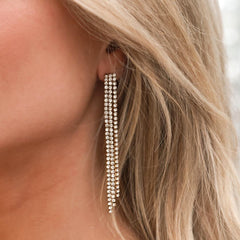 Gouden oorbellen covered in diamonds