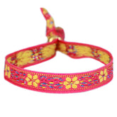 Pulsera tejida flor rosa amarilla
