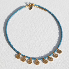 Collier Miyuki avec pièce d'or bleue