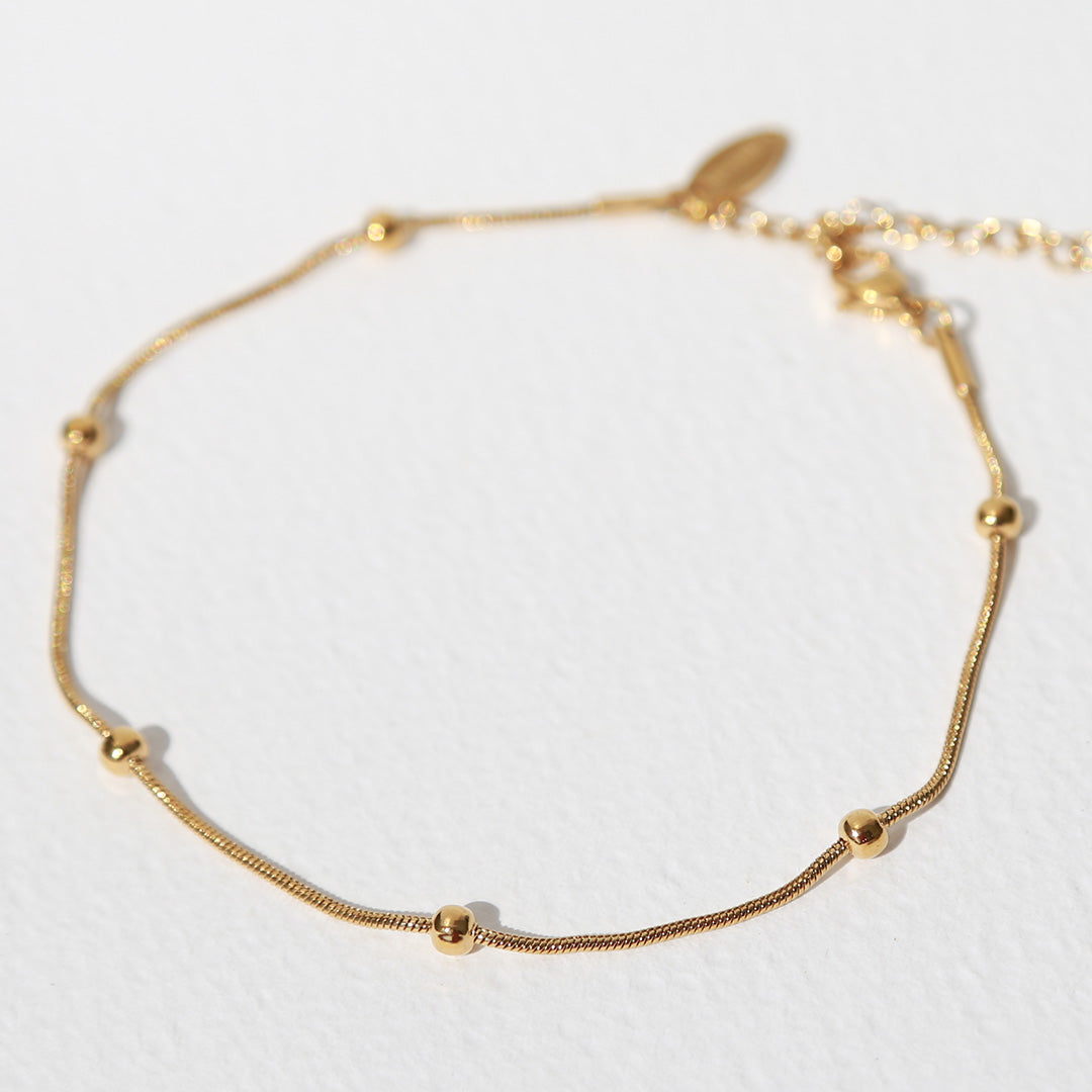 Bracelet de cheville boules dorées