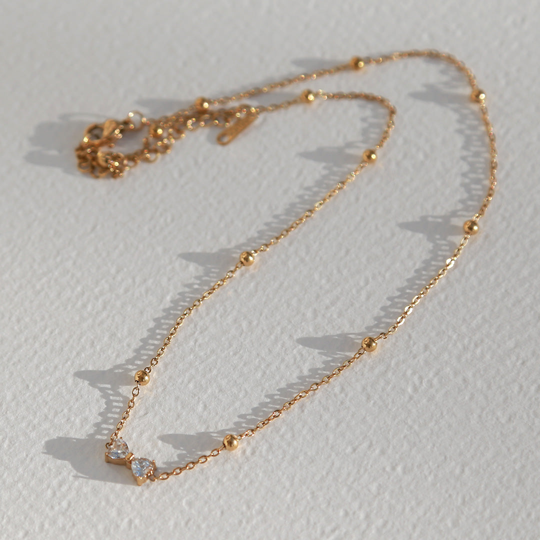 Gouden ketting strikje strass