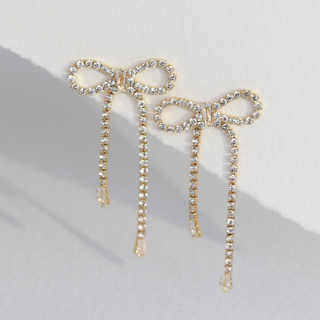 Boucles d'oreilles en or avec strass en forme de nœuds